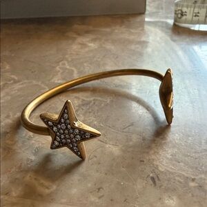 Two star open cuff bracelet with crystal pave darkened gold tone